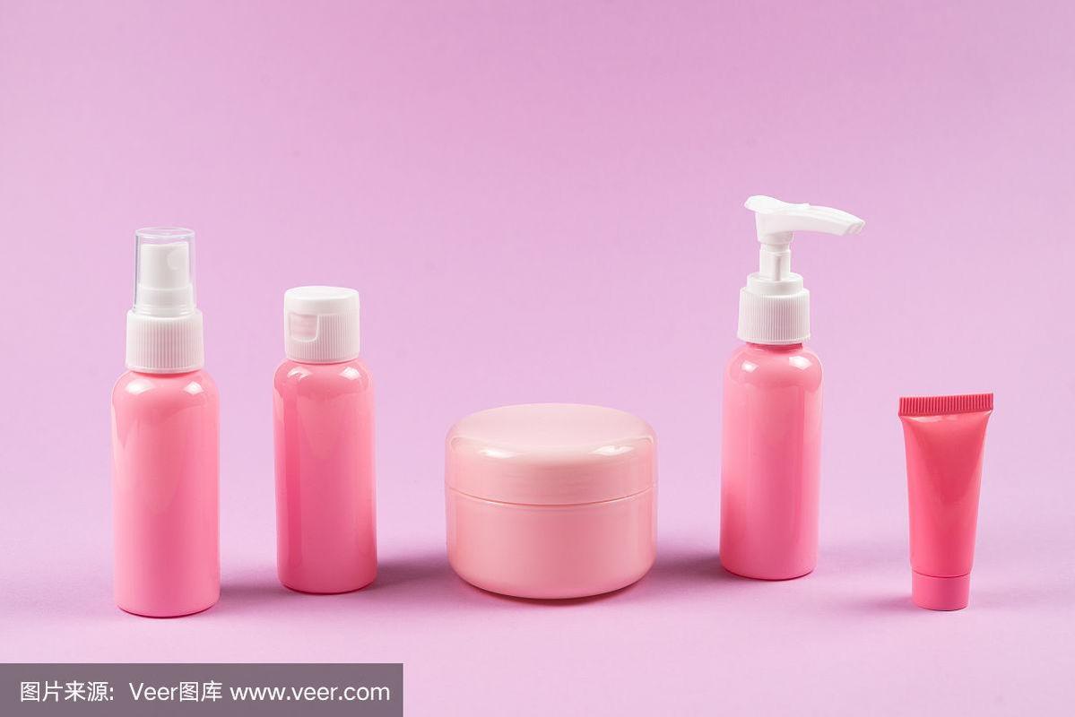 粉色塑料瓶用于卫生用品,化妆品,卫生用品上的粉色背景.